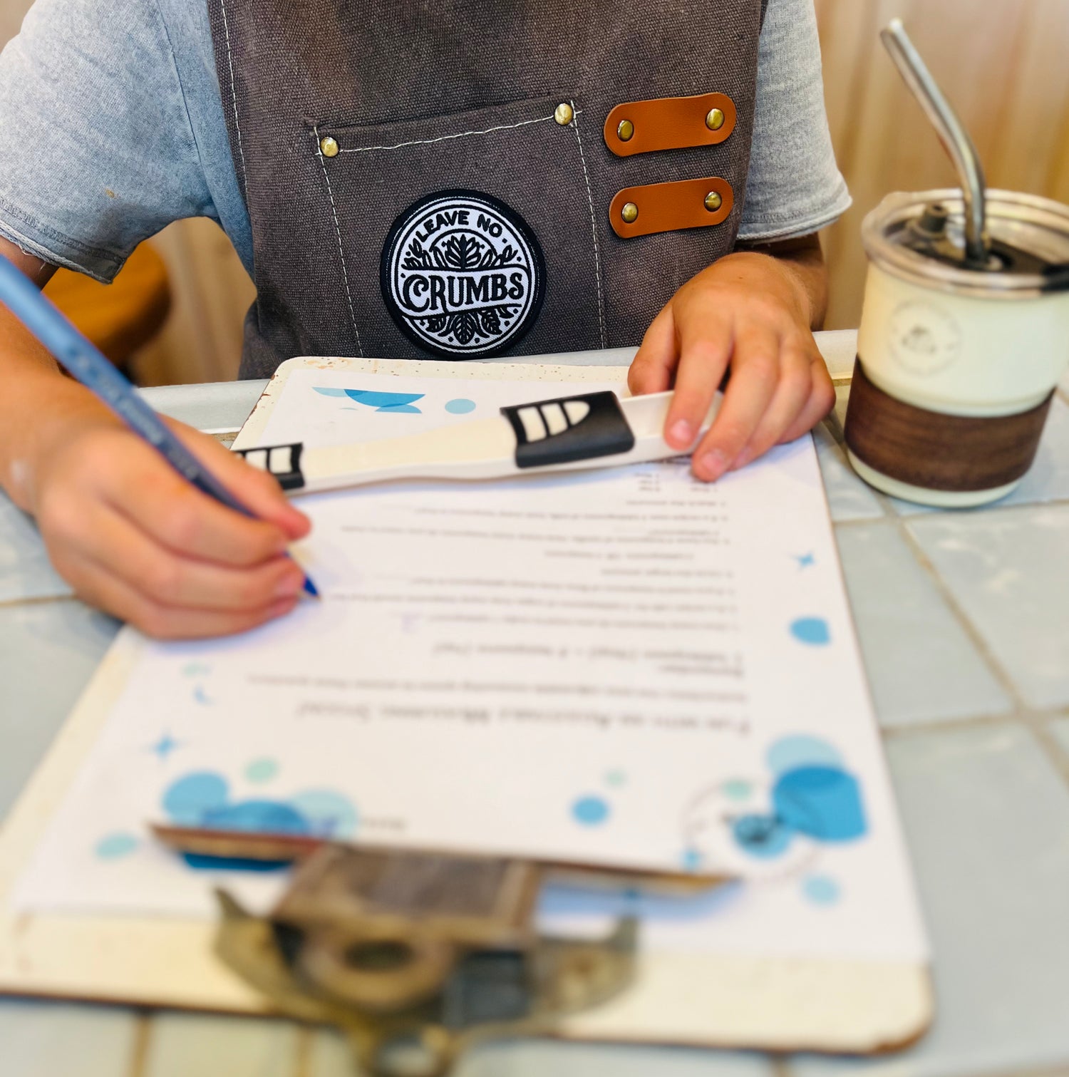 child doing math with their adjustable measuring spoon