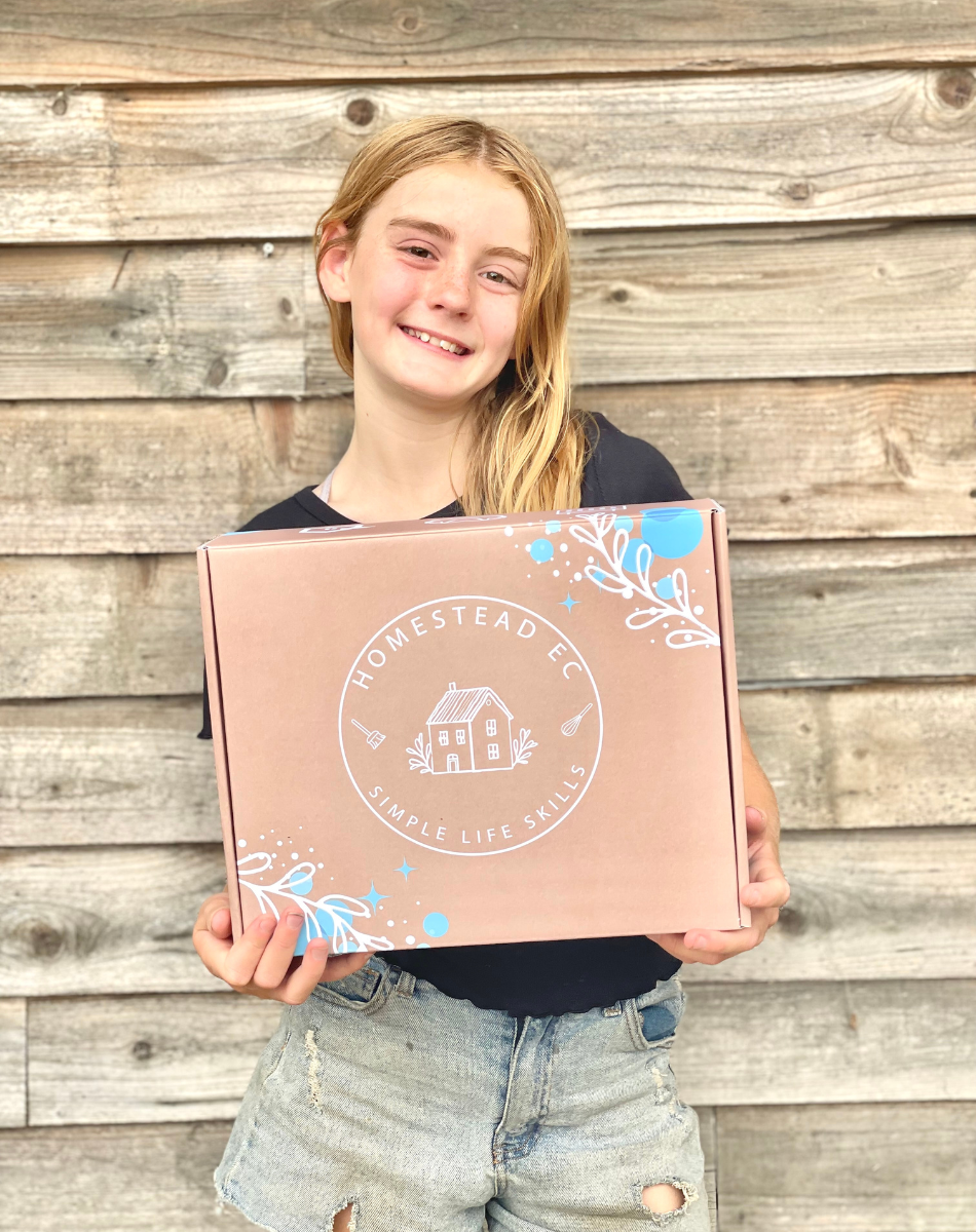 tween girl holding subscription box