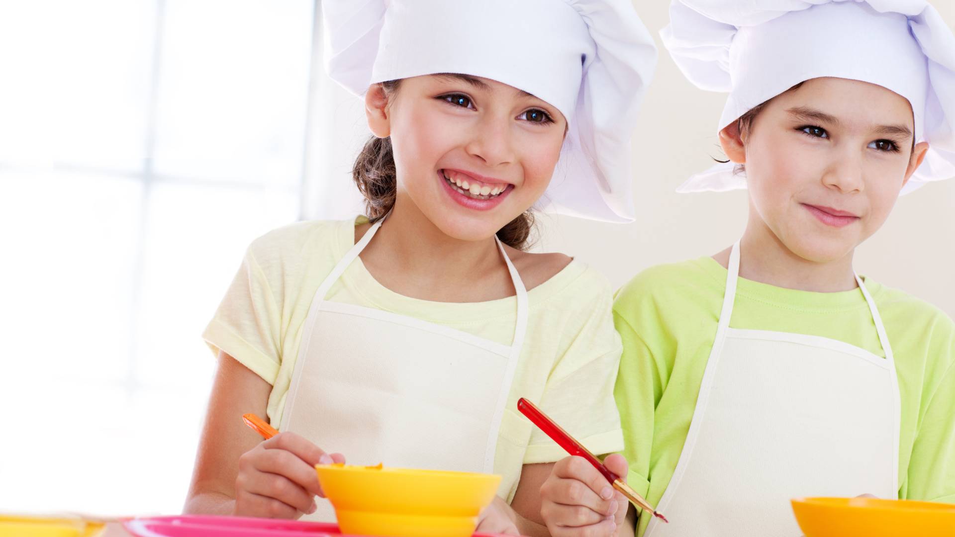 two kids cooking