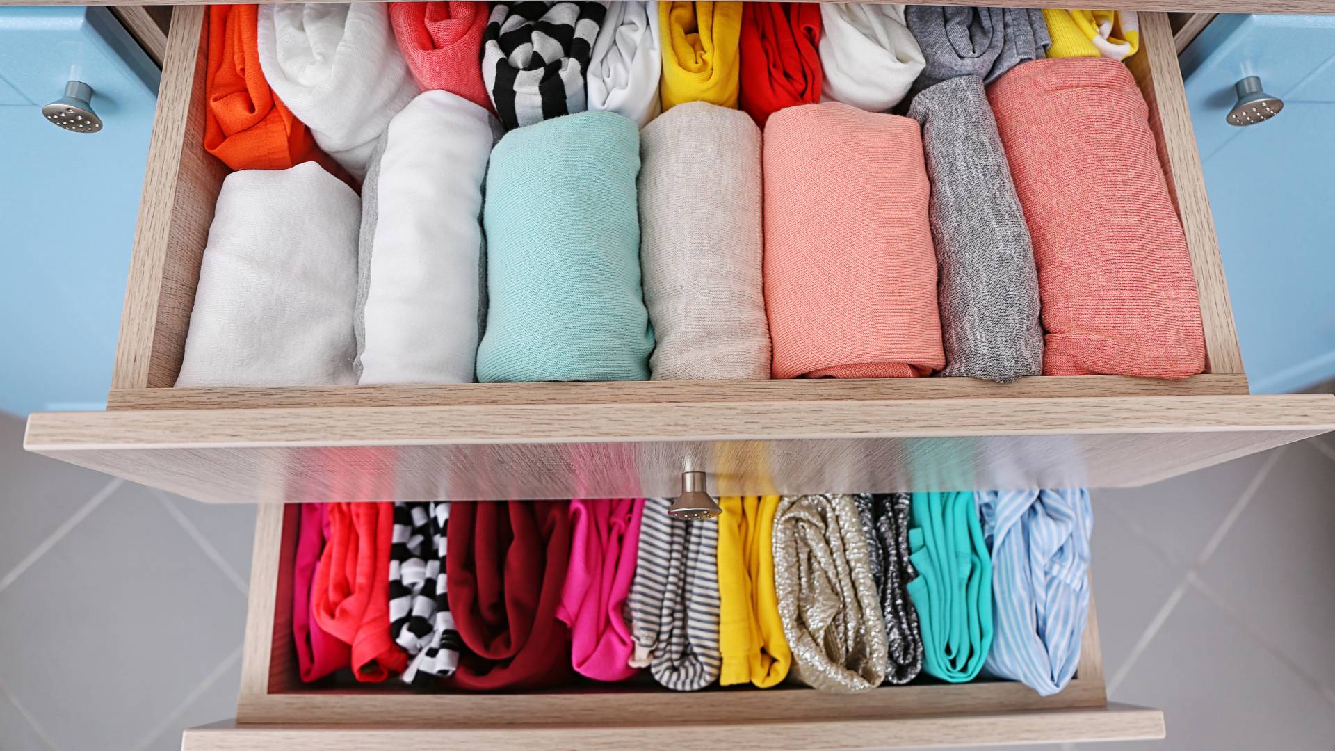 neatly folded clothes in drawers